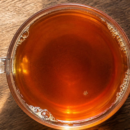 Anti inflammatory drink made with ginger tulsi turmeric cinnamon and fennel seeds in hot water — IBS-friendly caffeine-free morning tea