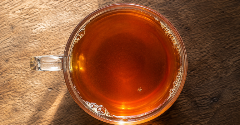 Anti inflammatory drink made with ginger tulsi turmeric cinnamon and fennel seeds in hot water — IBS-friendly caffeine-free morning tea